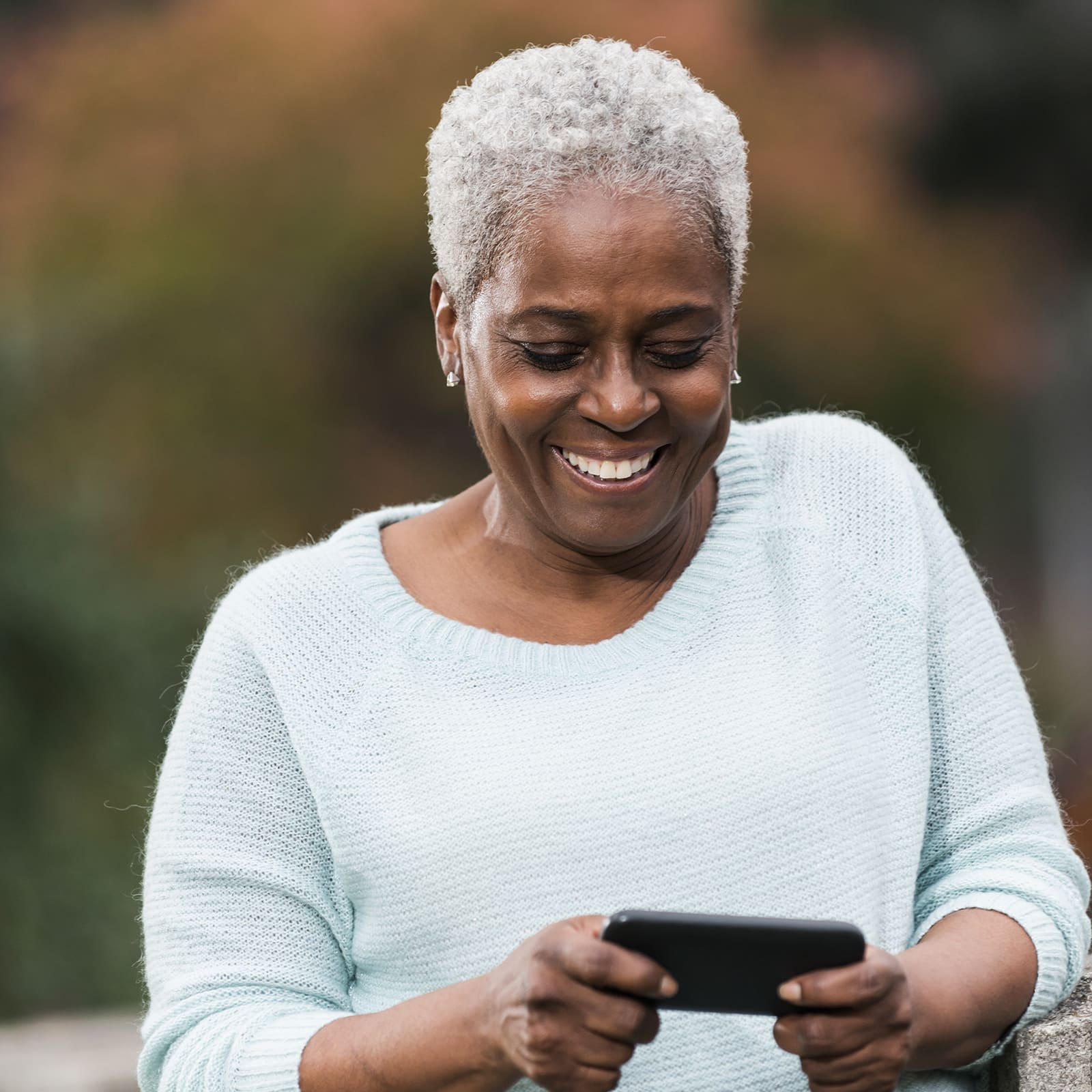 Senior African American woman texting-1600x1600-min