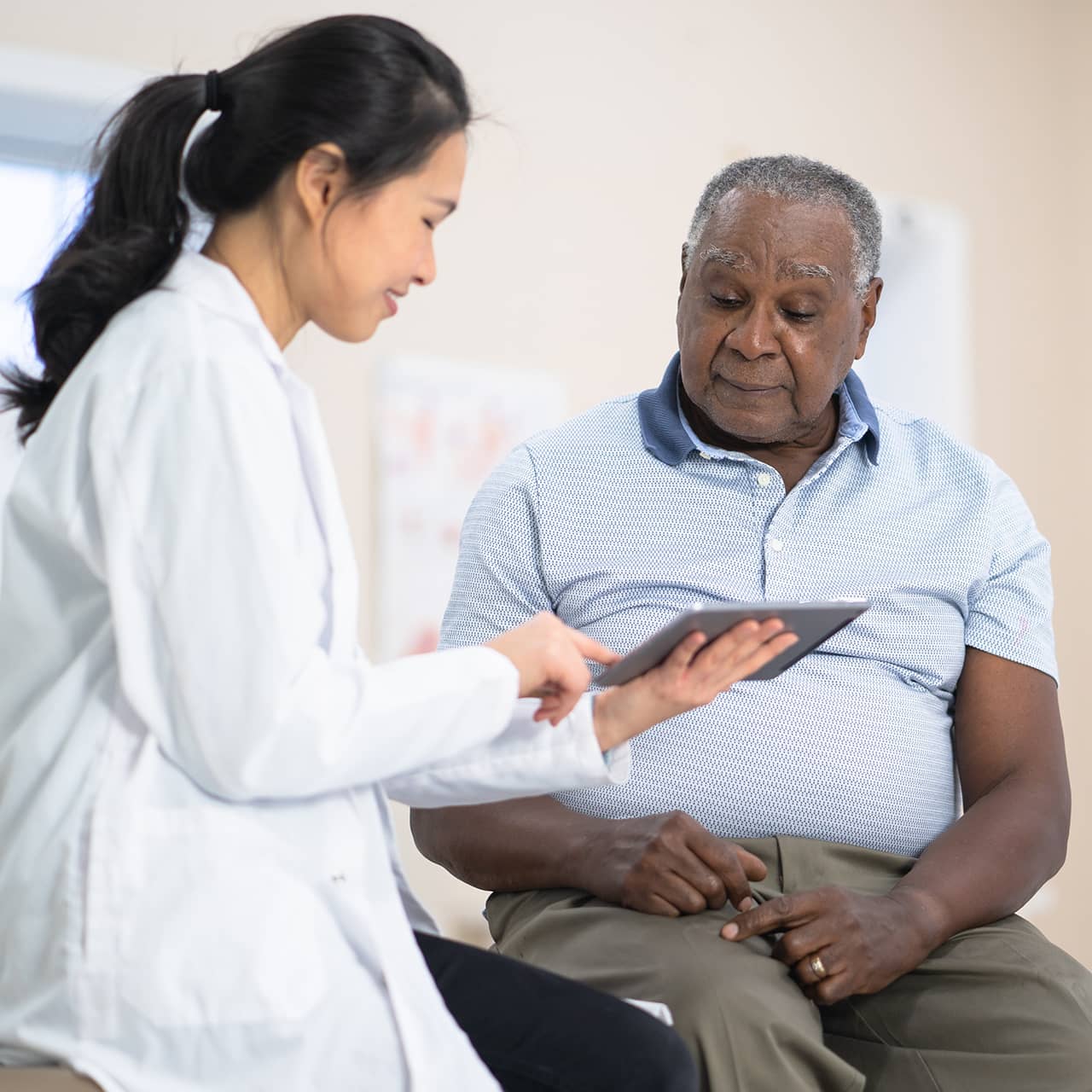 Senior man talking to doctor